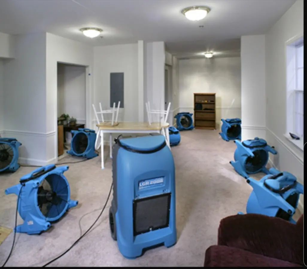 Air movers and dehumidifier setup for Water Damage Restoration in Ellsworth